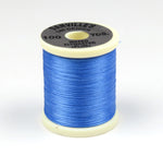 Close-up of 140 Denier Danville thread spool from Clouser's Fly Shop, showing dark brown thread wound on the spool.