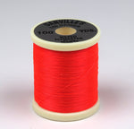 Close-up of 140 Denier Danville Thread by Clouser's Fly Shop, showing the fine, durable gray thread spool.