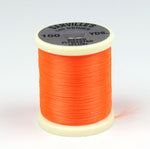 Close-up of 140 Denier Danville Thread by Clouser's Fly Shop, showing the dark woven spool of strong, durable fly tying thread.