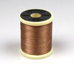 Close-up of 140 Denier Danville thread by Clouser's Fly Shop, showing the dark brown spool of strong, durable fly tying thread.