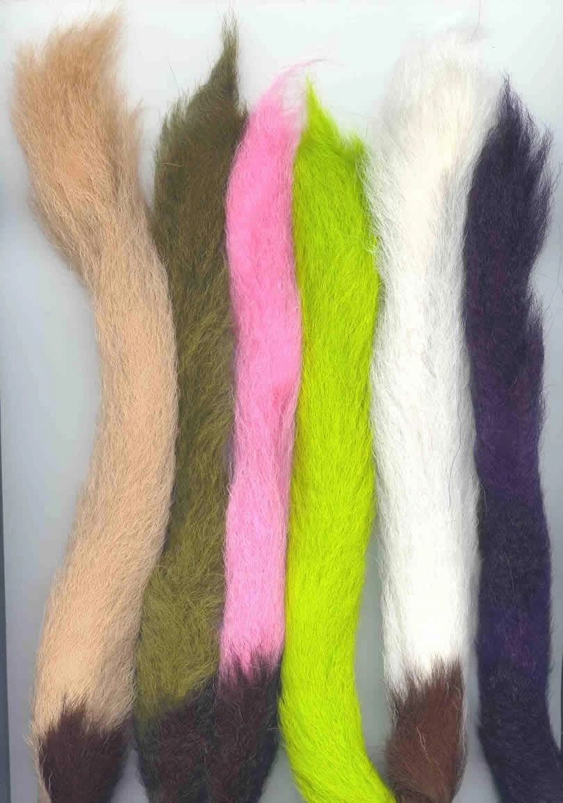 Close-up of a calf tail used as fly tying material, showcasing natural hair texture and color for fishing fly creation.