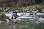 Chartreuse Humpy dry fly, barbless trout dry fly with hair wing, size 12, from The Fly Fishing Place, shown in winter fishing setting.