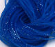 Close-up of Crazy Legs fly tying material by Clouser's Fly Shop, showing textured, flexible legs ideal for fly fishing lures.