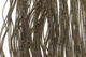Close-up of Crazy Legs fly tying material from Clouser's Fly Shop, showing vibrant, textured strands for fly fishing lures.