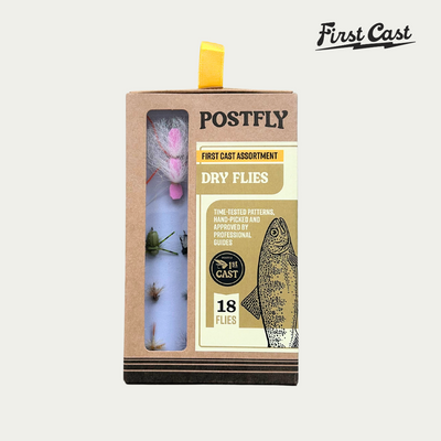 Box of Postfly First Cast assortment with fishing flies on a white background