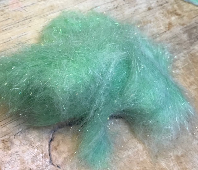 Close-up of Clouser's Dubbing in natural shades, showcasing the textured, fuzzy material used for fly tying from Clouser's Fly Shop.