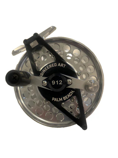 Clouser's Fly Shop Old Mariner Inshore Series 912 fishing reel with metal body and handle, designed for saltwater fishing.