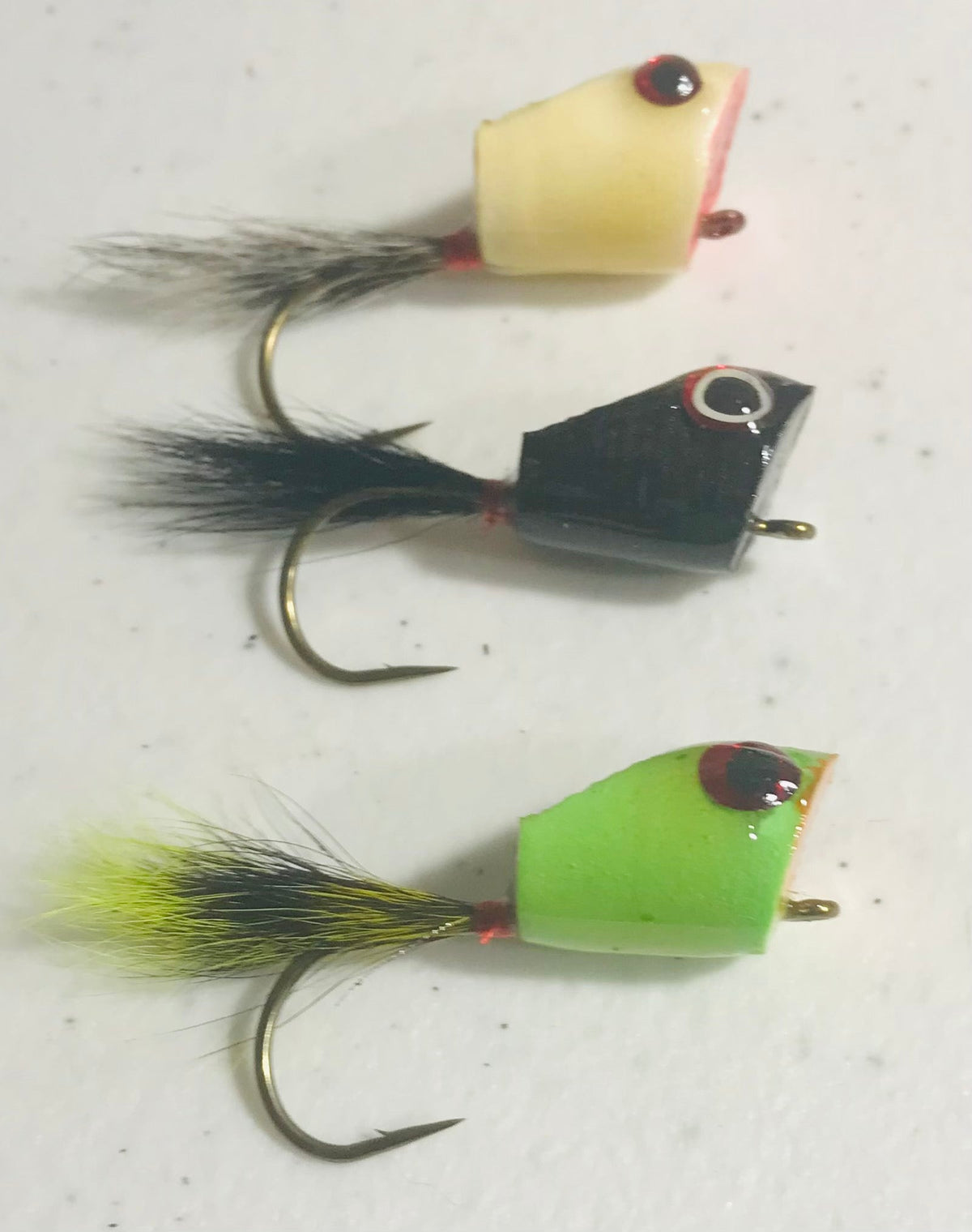 Clouser EZ Popper squirrel tail fishing fly with orange and white colors, designed for attracting fish in freshwater and saltwater.