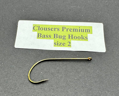 Close-up of Clouser's Premium Bass Bug Hooks, sharp metal hooks designed for bass fishing, displayed on a plain background.