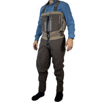 Person wearing brown waders and a blue shirt on a white background