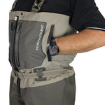 Person wearing a gray and black waders with 'Paramount' branding, holding a watch.