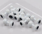 Painted lead eyes for fly tying, designed for fishing lures, by Clouser's Fly Shop, showing close-up of the lead eye components.
