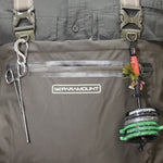 Fishing reel and tools attached to a gray bag with 'Paramount' branding.