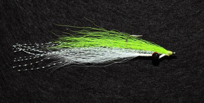 Clouser deep minnow on a black background, tied with white and chartreuse