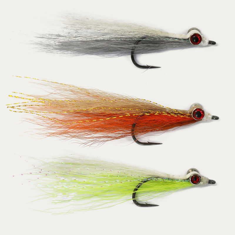 Three fishing lures with different colors on a white background