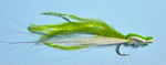 Green and white fly fishing lure on a blue background
