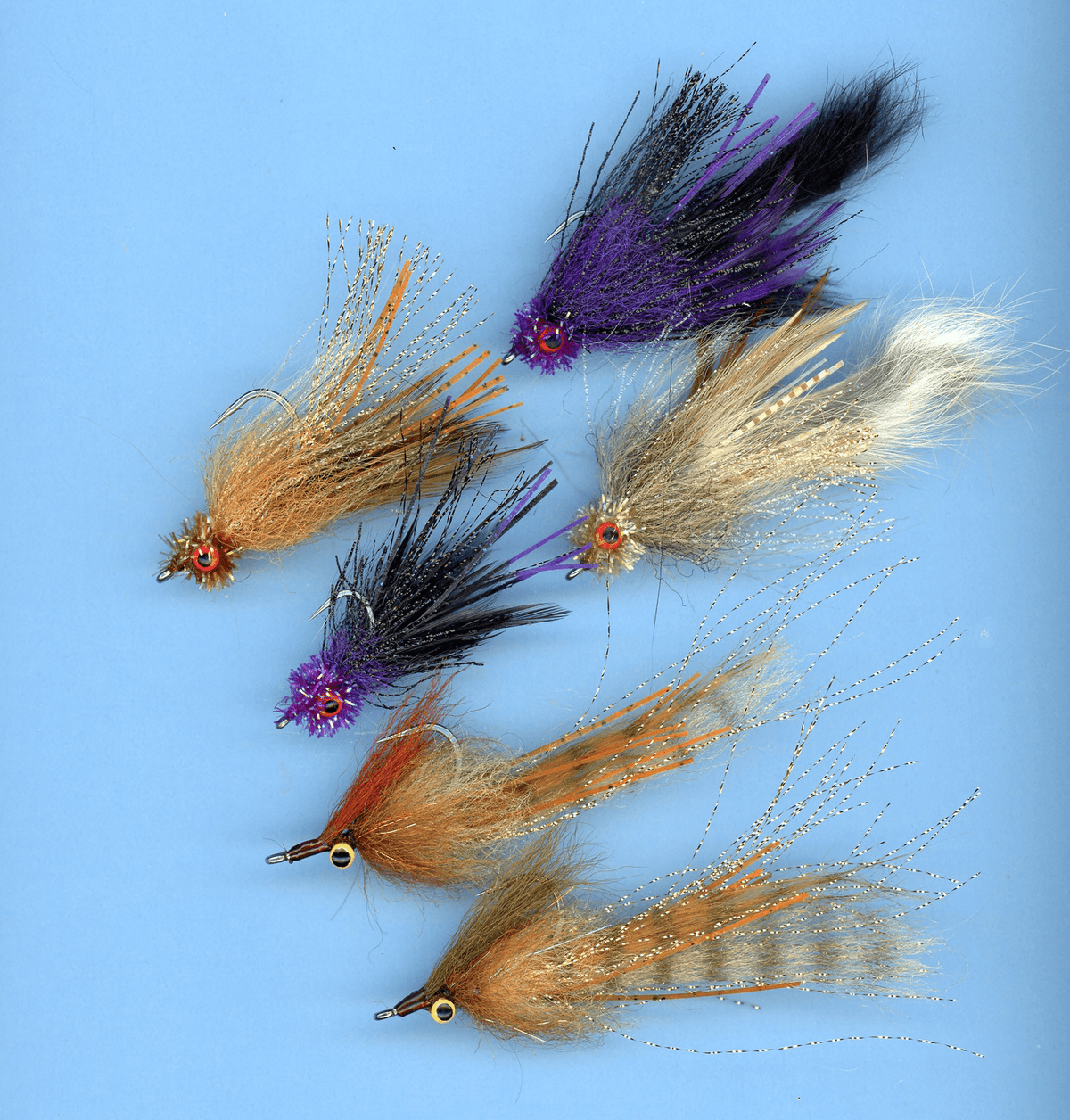 Assorted fishing flies from Clouser's Fly Shop, including pinfish patterns, for backcountry fishing and fly fishing adventure