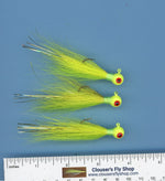 Three 1/4 oz Bucktail Jigs with painted heads and eyes, featuring realistic fishing lure design from Clouser's Fly Shop.