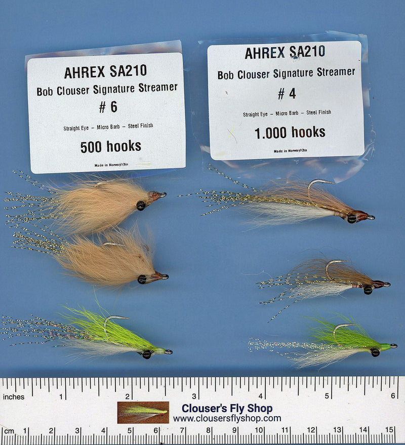 Assortment of Clouser's Fly Shop fishing flies, including Clouser's JP Crosscut Minnow and Clouser Deep Minnow, with hooks and colorful patterns.