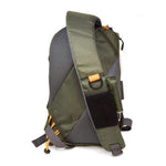 Jackson Hole Fly Company 13L adjustable sling fishing pack with multiple compartments and padded strap for comfortable outdoor use.