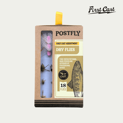 Box of Postfly First Cast assortment with fishing flies on a white background