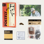 Collection of POSTFLY fly tying kit components on a white background