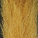 Close-up of Clouser's Fly Shop calf tail fly tying material with soft, natural-colored hair for fishing lures.